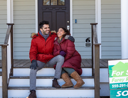 family outside new home