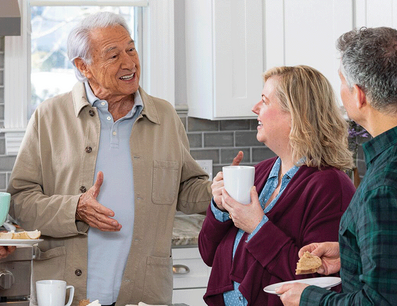 Adults talking over coffee